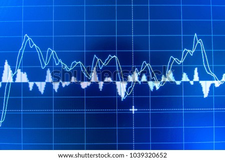 Stock market data on LED display on laptop screen for finance and economic. Business graph background.