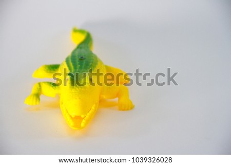 Alligator, Plastic Toy Animal isolated on white background.