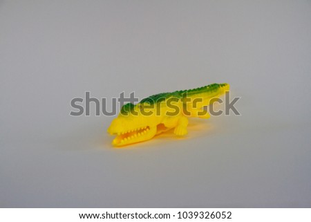 Alligator, Plastic Toy Animal isolated on white background.