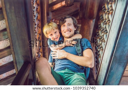 Happy tourists dad and son in Pagoda. Travel to Asia concept. Traveling with a baby concept