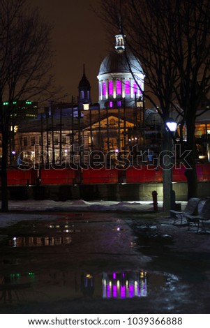 Old Montreal street view with historical buildings. Old Port of Montreal by night. View of old port in Montreal. Montreal Downtown Panorama at winter night.