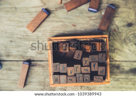 Linguistic Education concept: Wooden Text rubber stamp vintage color tone 