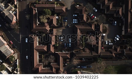 Aerial drone image of roofing on residential buildings in south west London on a Sunny Day.