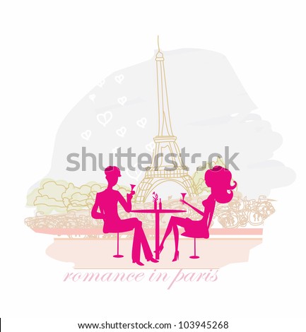 Young couple flirt and drink champagne in Paris