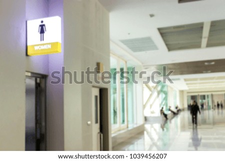 Blur image of the front of the female toilet.
