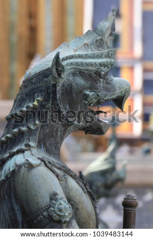Close up bird half man half iron statue in Wat Phra Keaw, Bangkok Thailand
