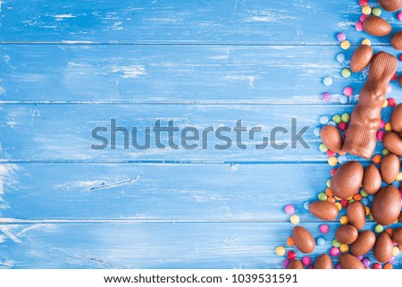Easter background with chocolate rabbit and Easter eggs