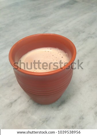 Tea in Kullad (cup of mud) on grey background