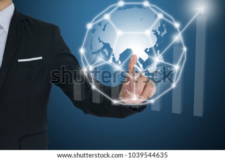 Businessman touching global  network and Financial charts showing growing revenue. communication and social media concepts.