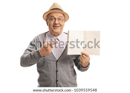 Mature man holding a blank notebook and pointing isolated on white background