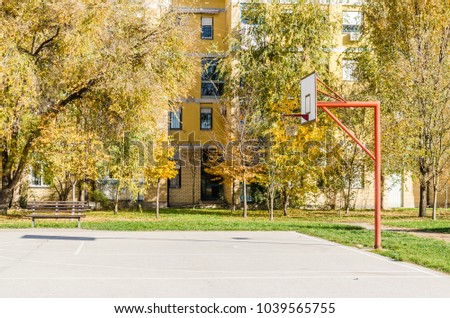Open basketball court in front of the building 