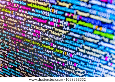 CSS, JavaScript and HTML usage. Programmer occupation job. Mobile app developer. Data network hardware Concept. Website HTML Code on the Laptop Display Closeup Photo. Binary digits code editing. 