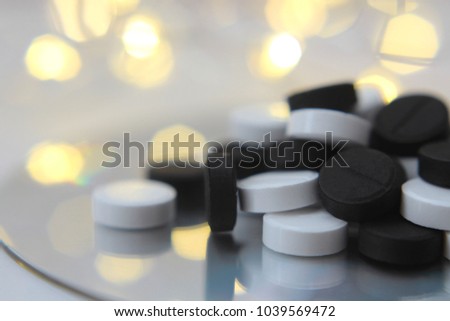 A medical tablet, a medicine. Black and white. Can be used as a background or ad decoration wich copy space. 