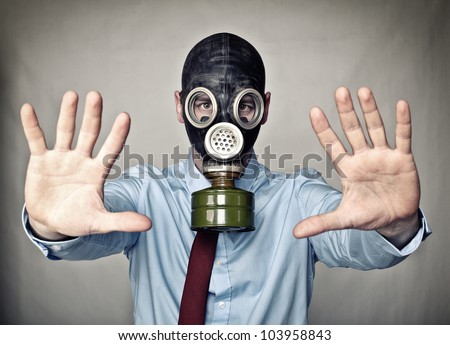 businessman with gas mask stop posture Royalty-Free Stock Photo #103958843