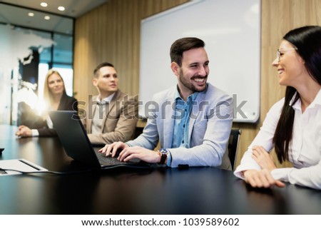Portrait of business couple in conference room