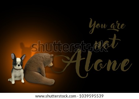 Teddy bear and dog sit on a brown background with the letter word you are not alone.