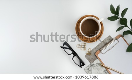 Styled stock photography white office desk table with blank notebook, computer, supplies and coffee cup. Top view with copy space. Flat lay. Royalty-Free Stock Photo #1039617886
