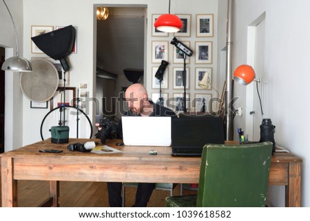 photographer working in his photography studio