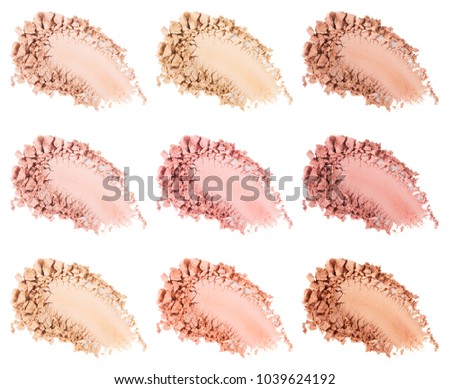 Face powder. Smears of foundation for face. Cosmetic smear. Make up crushed powder. Isolated on white background Royalty-Free Stock Photo #1039624192