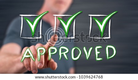 Man touching a validation concept on a touch screen with his finger