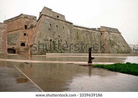Ancient castle of Mola di Bari on a cloudy winter morning.