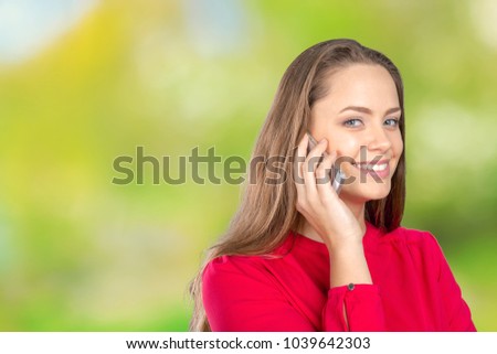 Beautiful young woman with mobile phone