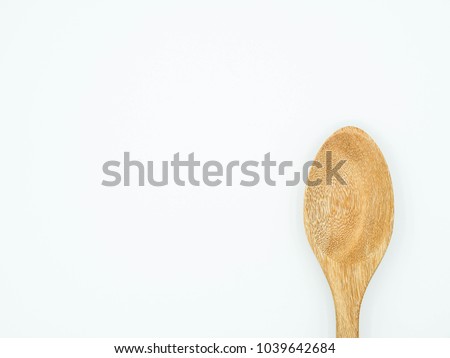 Close up wooden spoon isolated on white background. Reduce global warming concept.     