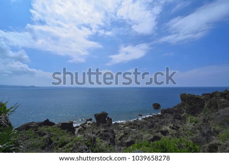 Seaside rocks and rocks in southern Taiwan are a beautiful picture and journey under the blue sky.
