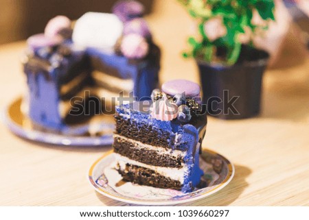 a piece of delicious festive lilac cake with berries on a plate