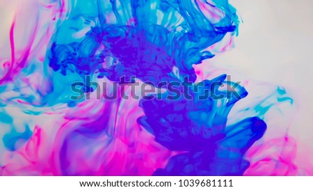 colored ink spilled in water Royalty-Free Stock Photo #1039681111