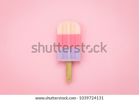 Table top view aerial image of sign or food of summer season holiday background concept.Flat lay of pastel ice cream on modern rustic pink paper backdrop.Minimalism creative design. 