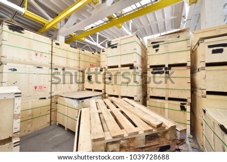 Large and light warehouse, cargo storage in wooden boxes