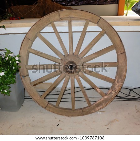 brown old wooden wheel isolated on white background
