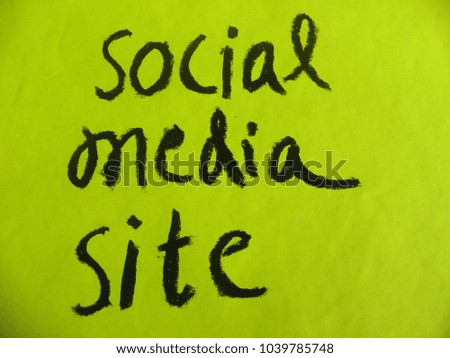 Text social media site hand written by black oil pastel on yellow color paper