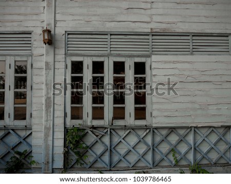 Old wooden house and brown lamp. (background)