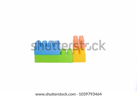 Plastic building blocks isolated on white background.