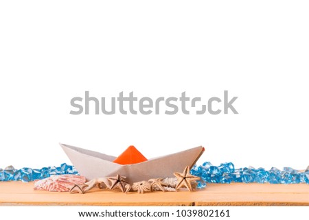 Paper boat on a table with isolated background