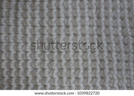 Texture of white knitted fabric from above