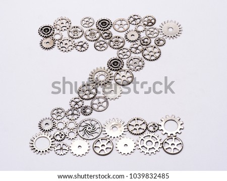 Letters in English alphabet font by Watch Part Steampunk Jewelry Art Craft Cyberpunk Gear Wheel on a white background