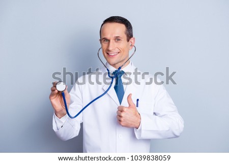 Cardio wellness pharmacist office medicare profession people person concept. Portrait of smart satisfied friendly doc making thumb-up symbol listening to copy-space isolated on gray background