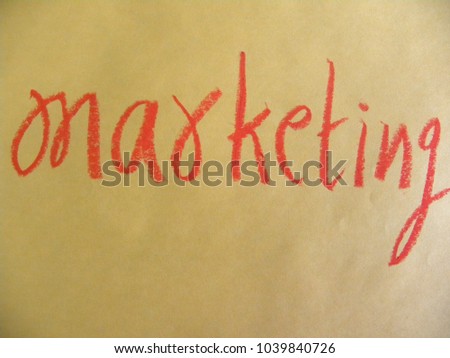 Text marketing hand written by red oil pastel on orange color paper