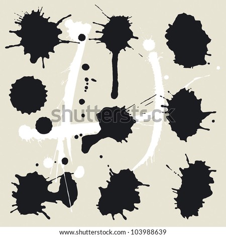 Vector set of black ink stains on the beige background