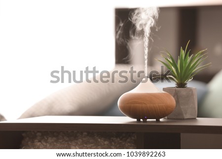 Aroma lamp on table Royalty-Free Stock Photo #1039892263