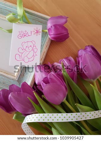 Purple tulips laying on a picture frame, It's a girl tag, Baby shower, Celebration