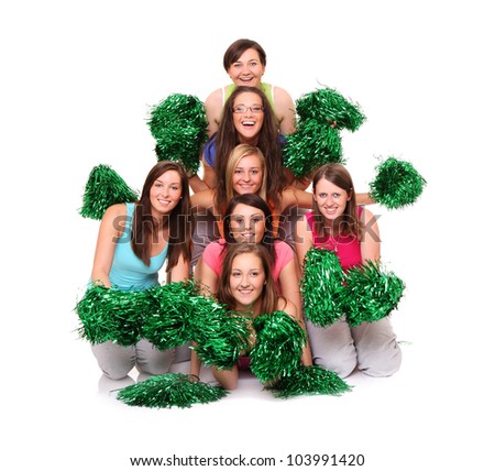 A picture of a team of young beautiful cheerleaders posing over white background