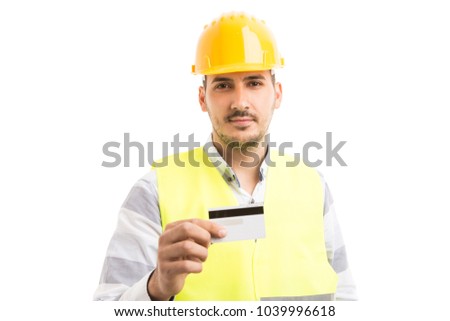 Professional engineer or constructor holding and showing credit card as easy renovating construction payment concept