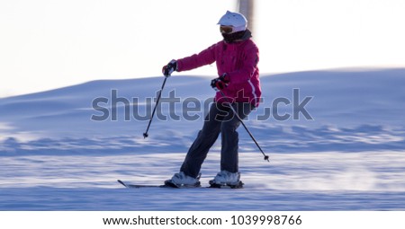 A man skiing in a ski resort