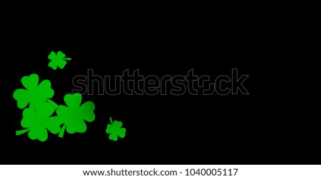 St. Patrick's Day. Green clover leaves on black background