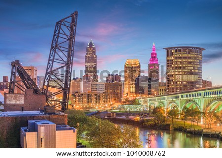 Cleveland, Ohio, USA city skyline over the Cuyahoga River.