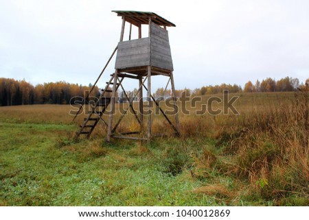 Biotechnical structure intended for hunting and watching wild animals, against the backdrop of autumn nature.